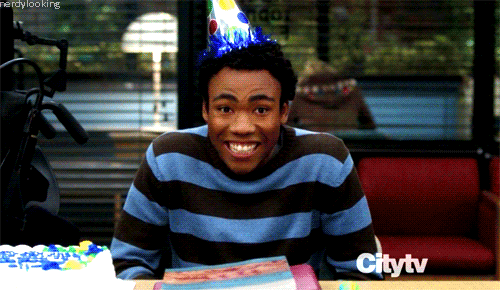 Troy from Community in a birthday hat